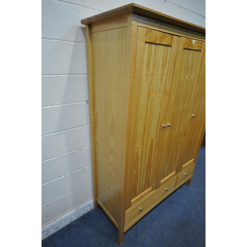 1345 - A MODERN PINE TRIPLE DOOR WARDROBE, with two drawers, width 139cm x depth 54cm x height 188cm (condi... 