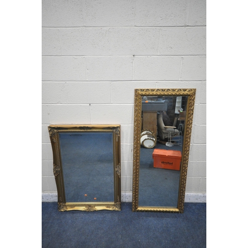 1352 - A RECTANGULAR GILT RESIN BEVELLED EDGE WALL MIRROR, with foliate details,108cm x 77cm, along with an... 