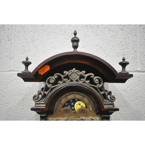 1353 - A WARMINK WUBA STYLE DUTCH WALL CLOCK, the arched top with three finials, above scrolled details, th... 