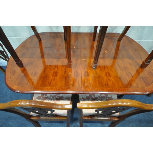 1357 - A 20TH CENTURY MAHOGANY OVAL EXTENDING DINING TABLE, with one fold out leaf, length 145cm x depth 94... 