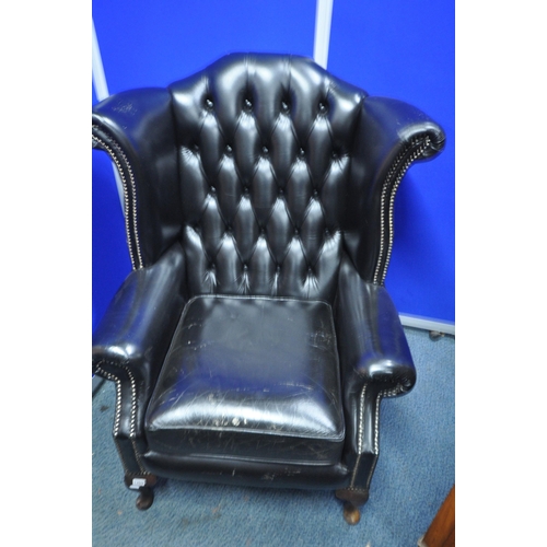 1359 - A BLACK LEATHER UPHOLSTERED BUTTONED WINGBACK CHESTERFIELD STYLE ARMCHAIR, width 82cm x depth 75cm x... 