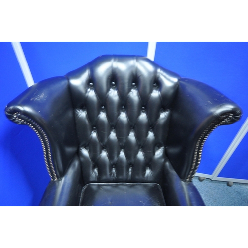 1359 - A BLACK LEATHER UPHOLSTERED BUTTONED WINGBACK CHESTERFIELD STYLE ARMCHAIR, width 82cm x depth 75cm x... 