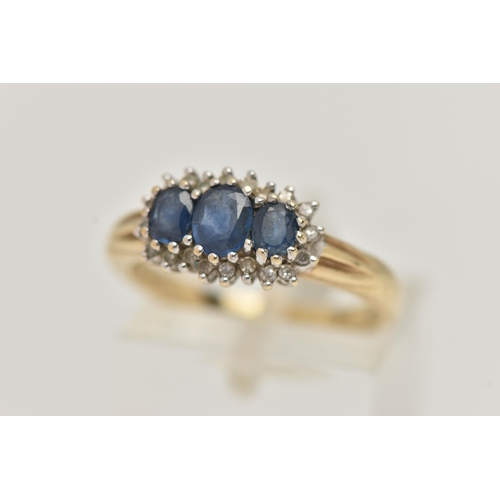 63 - A 9CT GOLD SAPPHIRE AND DIAMOND RING, designed as three graduated oval sapphires within a single cut... 