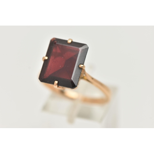 109 - A GARNET DRESS RING, a large rectangular cut garnet, approximate length 13mm x width 11mm, four pron... 