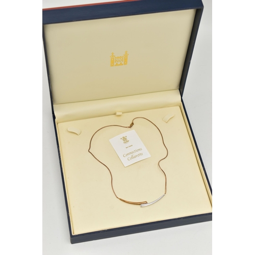 115 - A 9CT GOLD 'ROYAL MINT' 'CONNECTIONS COLLARETTE' NECKLACE, a bicolor bypass style necklace, flush se... 