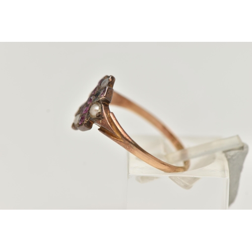 122 - A 15CT GOLD VICTORIAN GEM SET RING, designed as a cross set with predominantly oval cut rubies, four... 