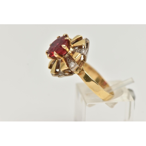 123 - A YELLOW METAL GEM SET DRESS RING, centering on a large circular cut garnet topped red paste doublet... 