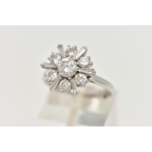 124 - AN 18CT WHITE GOLD DIAMOND CLUSTER RING, centering on a round brilliant cut diamond, estimated diamo... 