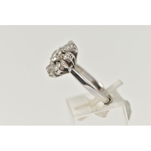 124 - AN 18CT WHITE GOLD DIAMOND CLUSTER RING, centering on a round brilliant cut diamond, estimated diamo... 