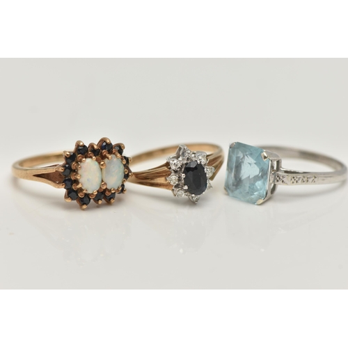 126 - THREE GEM SET RINGS, the first a 9ct yellow gold, double cluster ring, set with two oval cut opal ca... 