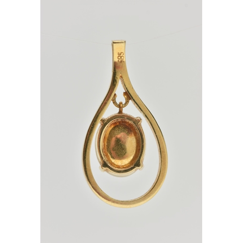 127 - A YELLOW METAL OPAL CABCOHON PENDANT, open work tear drop shape pendant, set with a central oval cut... 