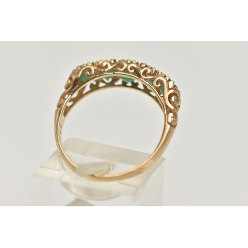 81 - A 9CT GOLD FIVE STONE EMERALD RING, five circular cut emeralds, each claw set, scrolling gallery and... 