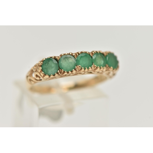 81 - A 9CT GOLD FIVE STONE EMERALD RING, five circular cut emeralds, each claw set, scrolling gallery and... 