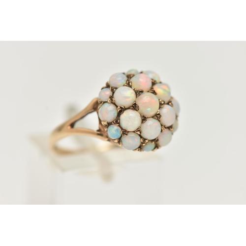 86 - A 9CT GOLD OPAL CABOCHON DOME RING, circular dome set with circular cut opal cabochons, approximate ... 