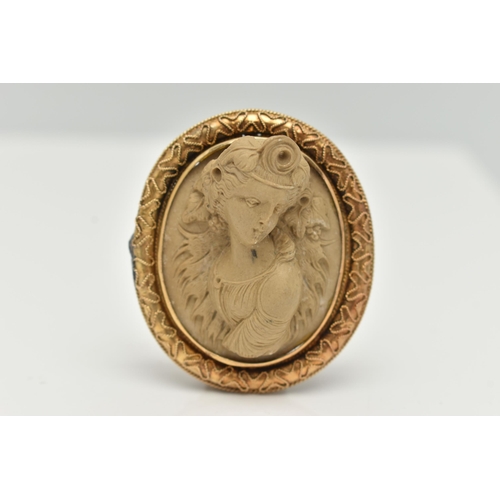 91 - A YELLOW METAL, HIGH RELIEF LAVA CAMEO BROOCH, of an oval form, depicting a lady in profile, collet ... 