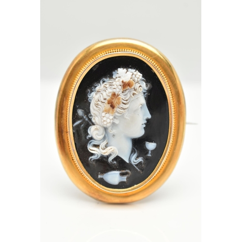 146 - A LARGE YELLOW METAL CAMEO BROOH, glass cameo depicting a lady in profile with grapes in hair, colle... 