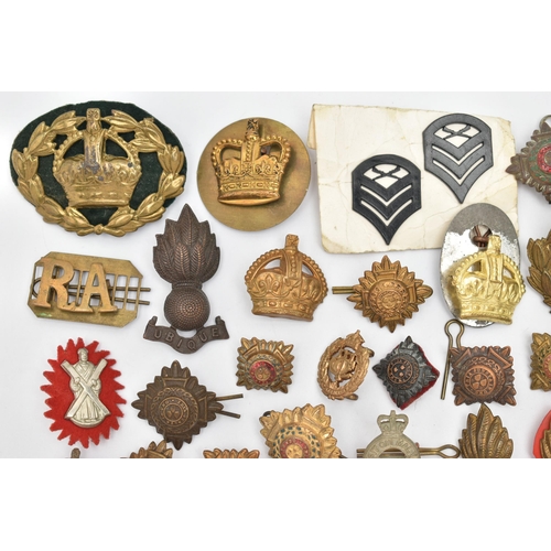 151 - A BAG OF ASSORTED MILITARY CAP BADGES AND PINS, various designs, some with enamel detail, various re... 