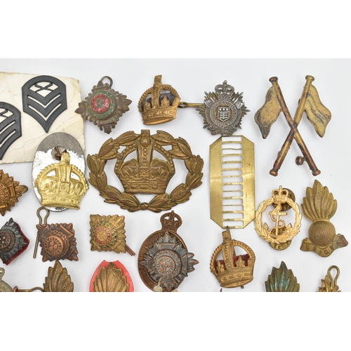 151 - A BAG OF ASSORTED MILITARY CAP BADGES AND PINS, various designs, some with enamel detail, various re... 