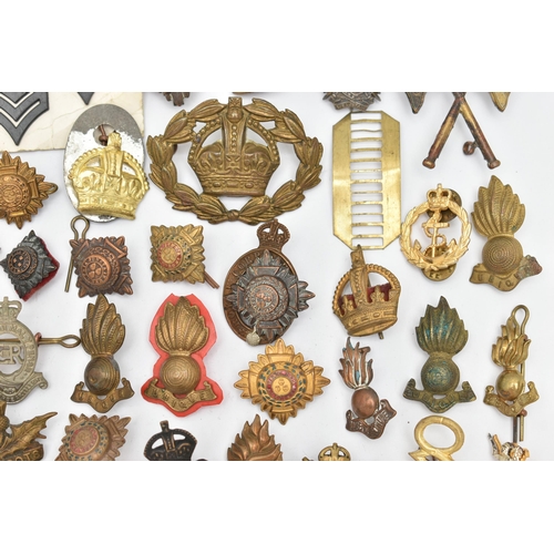 151 - A BAG OF ASSORTED MILITARY CAP BADGES AND PINS, various designs, some with enamel detail, various re... 