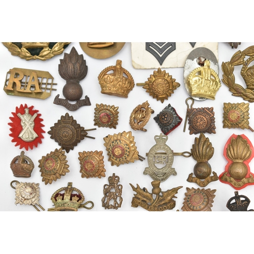 151 - A BAG OF ASSORTED MILITARY CAP BADGES AND PINS, various designs, some with enamel detail, various re... 