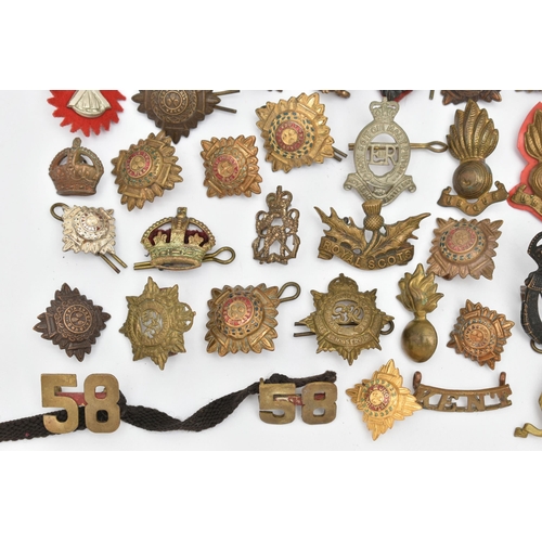 151 - A BAG OF ASSORTED MILITARY CAP BADGES AND PINS, various designs, some with enamel detail, various re... 