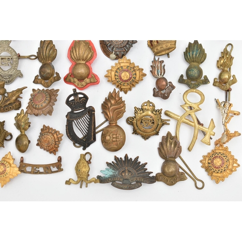 151 - A BAG OF ASSORTED MILITARY CAP BADGES AND PINS, various designs, some with enamel detail, various re... 