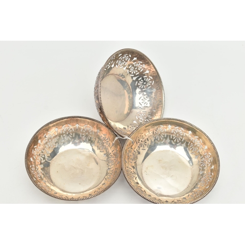 165 - THREE GEORGE V BONBON DISHES, the first a circular form dish with pierced detail and gadrooned edge,... 