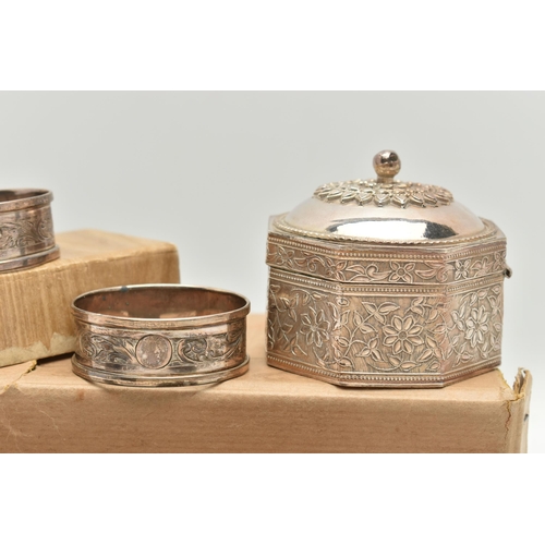 186 - SEVEN SILVER NAPKIN RINGS AND AN INDIAN TRINKET BOX, to include a set of four engine turned napkin r... 