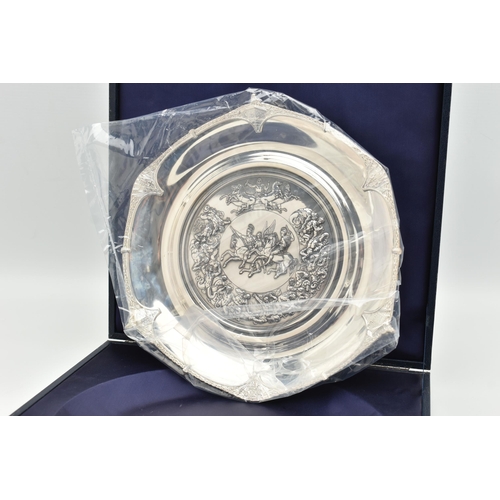 210 - A CASED 'ROYAL MINT' WATERLOO SILVER SALVER, depicting a battle of Waterloo scene, with the Arms of ... 