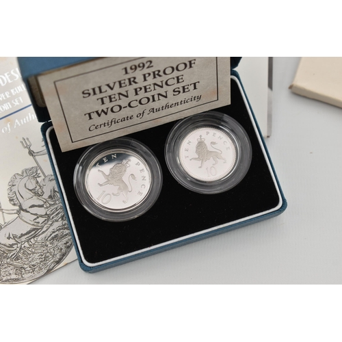 212 - A RED BOX OF ROYAL MINT SILVER AND SILVER PROOF COINS TO INCLUDE 17 BRITANNIA COINS (Some with Marks... 