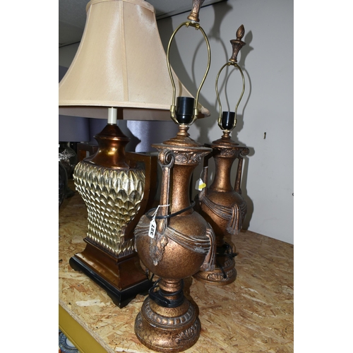 327 - THREE BRONZED TABLE LAMPS, comprising a pair of bronzed urn style lamps missing shades, height 80cm ... 