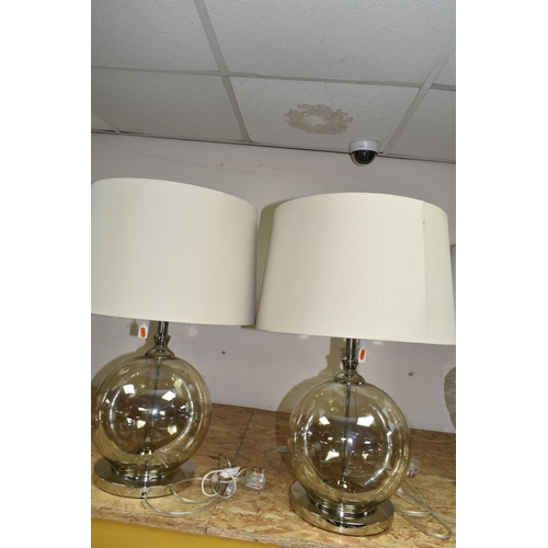 341 - TWO MODERN TABLE LAMPS, with glass bodies and wheat coloured shades, height to top of fitting approx... 