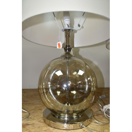 341 - TWO MODERN TABLE LAMPS, with glass bodies and wheat coloured shades, height to top of fitting approx... 