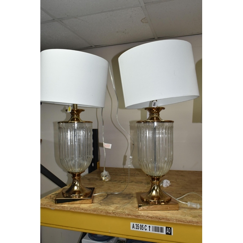 342 - TWO MODERN TABLE LAMPS, with glass bodies and off white shades, height to top of fitting approximate... 