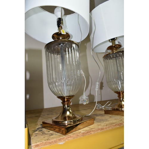 342 - TWO MODERN TABLE LAMPS, with glass bodies and off white shades, height to top of fitting approximate... 