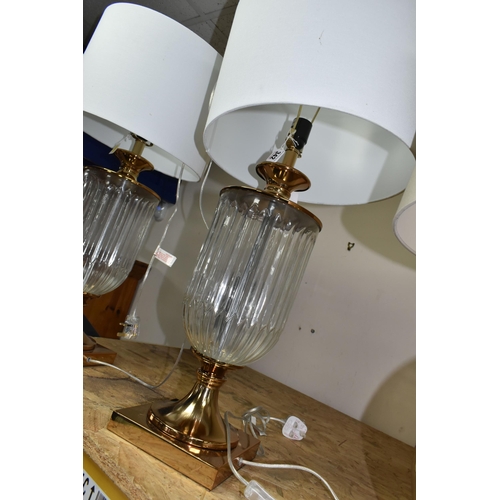 342 - TWO MODERN TABLE LAMPS, with glass bodies and off white shades, height to top of fitting approximate... 