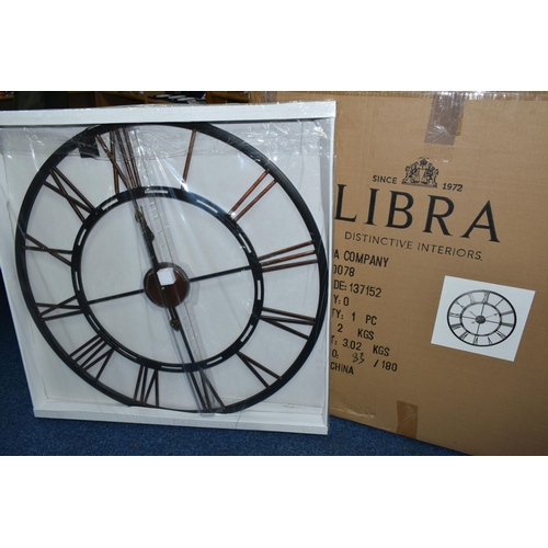 353 - A BOXED 'LIBRA' UNUSED WALL CLOCK, a black and bronze coloured metal wall clock with Roman numerals,... 