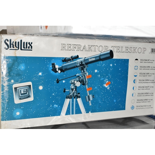 354 - A BOXED 'SKYLUX' REFACTOR TELESCOPE, 70m f/7 on an equatorial mount and tripod, with instructions fo... 