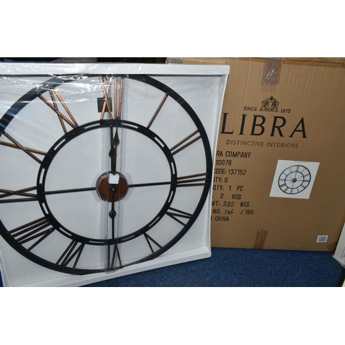 355 - A BOXED 'LIBRA' UNUSED WALL CLOCK, a black and bronze coloured metal wall clock with Roman numerals,... 