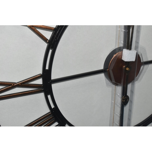 355 - A BOXED 'LIBRA' UNUSED WALL CLOCK, a black and bronze coloured metal wall clock with Roman numerals,... 