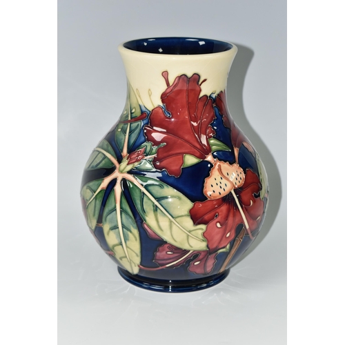 384 - A MOORCROFT POTTERY 'SIMEON' BALUSTER VASE, tubelined with red flowers on a blue and cream ground, i... 