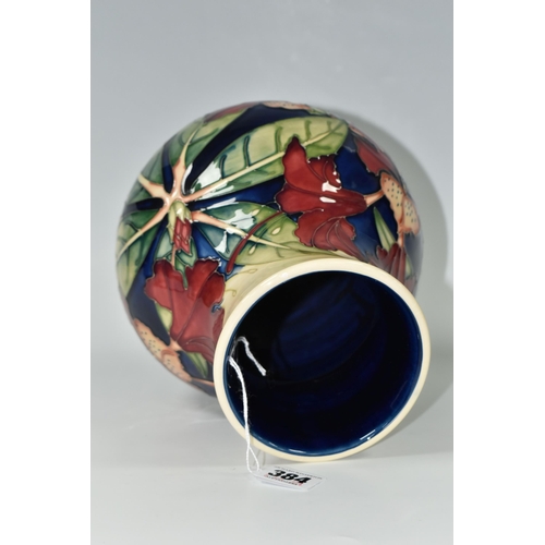 384 - A MOORCROFT POTTERY 'SIMEON' BALUSTER VASE, tubelined with red flowers on a blue and cream ground, i... 