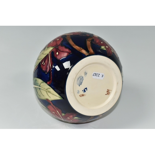 384 - A MOORCROFT POTTERY 'SIMEON' BALUSTER VASE, tubelined with red flowers on a blue and cream ground, i... 