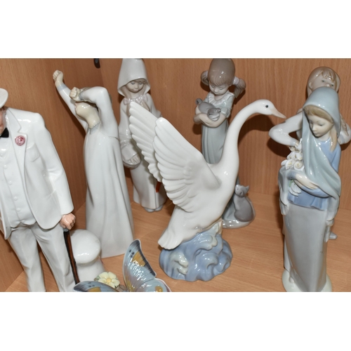 389 - SEVEN LLADRO FIGURES, A NAO DUCK AND A ROYAL DOULTON 'SIR WINSTON CHURCHILL' HN3057, A.F., the Lladr... 