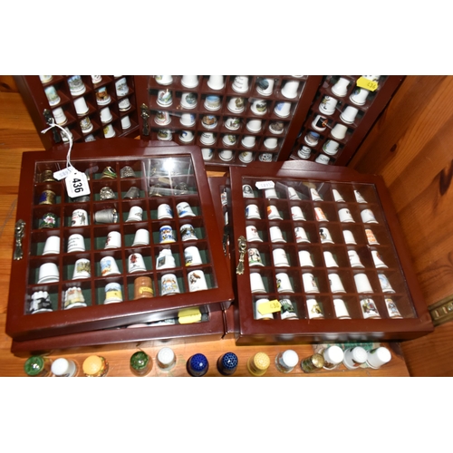 436 - A COLLECTION OF  THIMBLES, comprising seven wooden display cabinets and approximately four hundred a... 