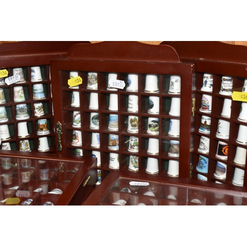 436 - A COLLECTION OF  THIMBLES, comprising seven wooden display cabinets and approximately four hundred a... 