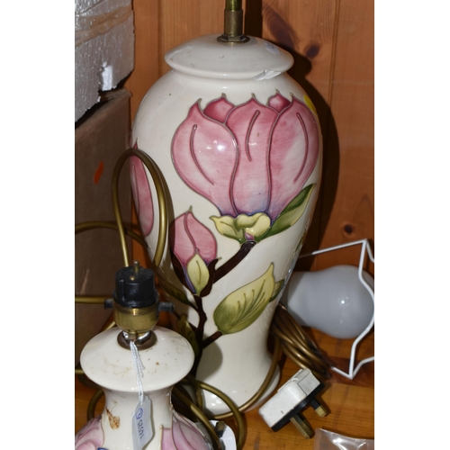 444 - A GROUP OF MOORCROFT TABLE LAMPS AND VASE, comprising a 'Magnolia' design table lamp, pale pink and ... 