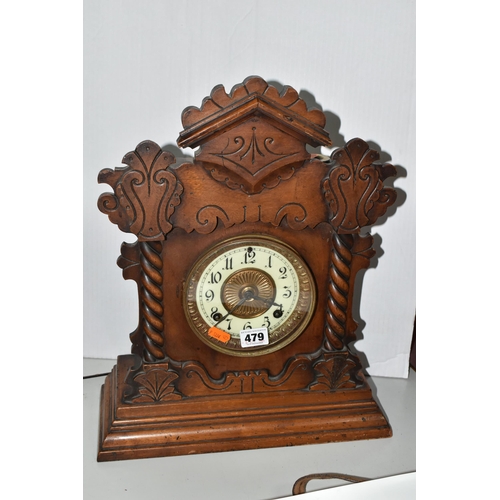 479 - A AMERICAN MANTEL CLOCK, made by The Ansonia Clock Company - New York, a stained pine gingerbread ty... 