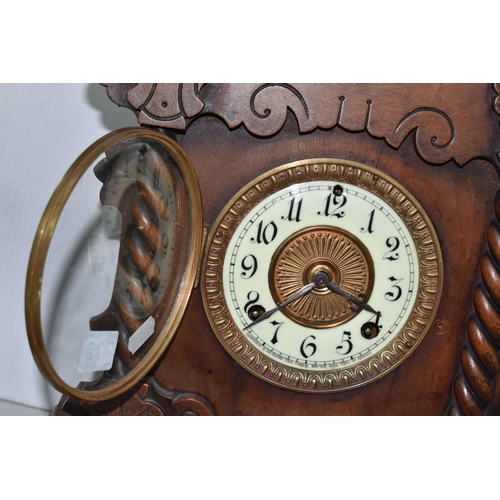 479 - A AMERICAN MANTEL CLOCK, made by The Ansonia Clock Company - New York, a stained pine gingerbread ty... 