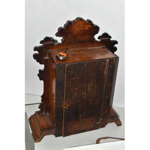 479 - A AMERICAN MANTEL CLOCK, made by The Ansonia Clock Company - New York, a stained pine gingerbread ty... 